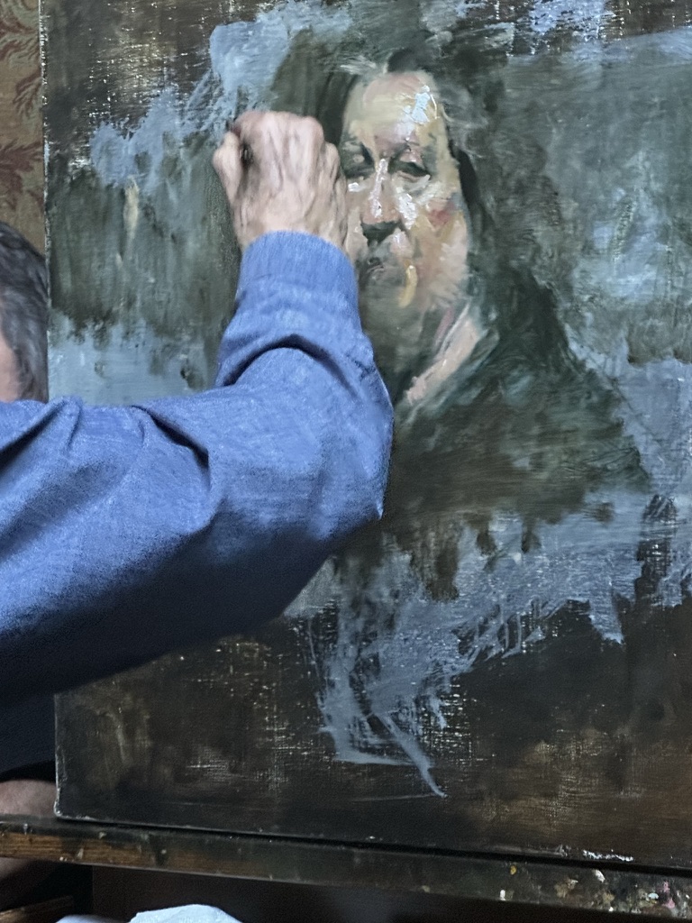 Master Artist David Leffel painting at his easel, Arroyo Seco, New Mexico 2023. Photograph by Carol D'Arcy.