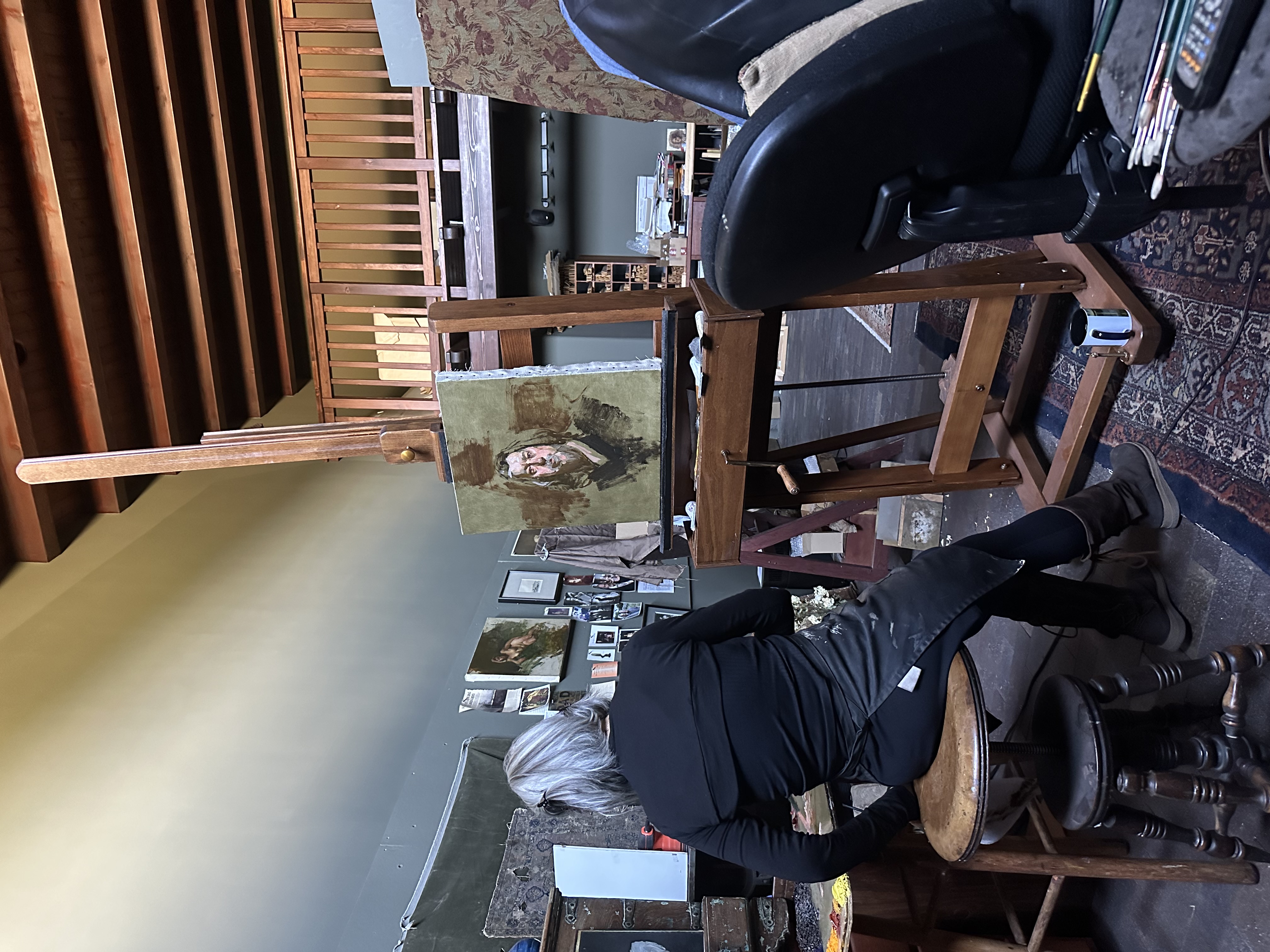 Master artist Sherrie McGraw painting in her studio, Arroyo Seco, New Mexico 2023. Photograph by Carol D'Arcy.
